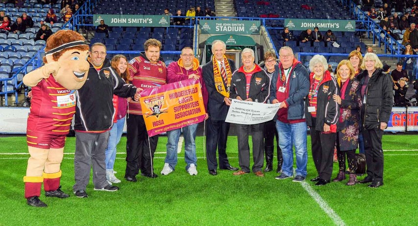Your committee presenting Ken Davy with a cheque for £14 000, the result of our 2018 efforts. The money goes towards the development of youth rugby.